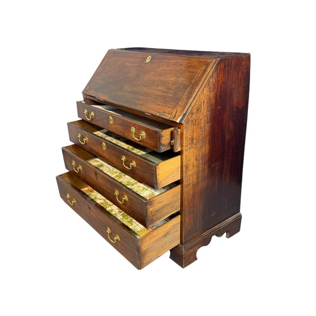This is an antique Georgian slant front writing bureau, dating from around 1800. The bureau features a slant front lid...