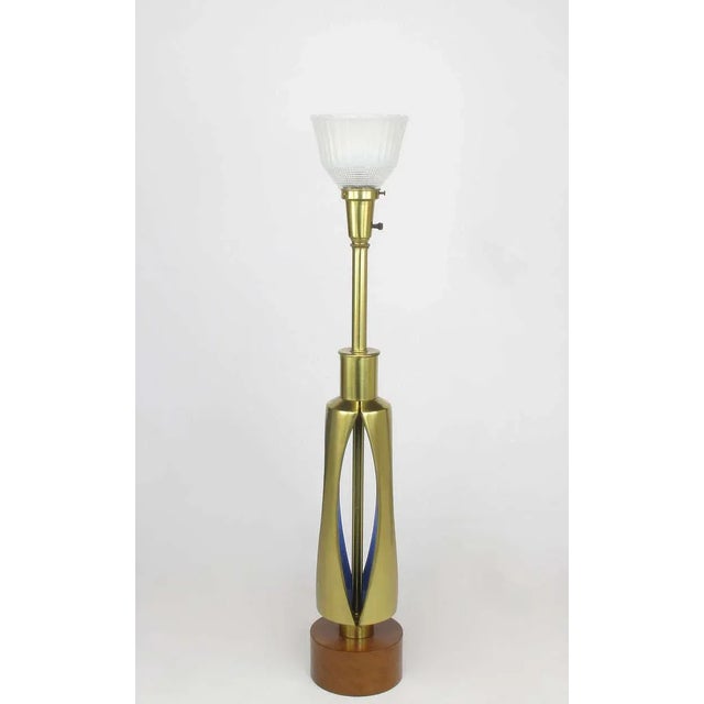 Unique open body brass table lamp from the Rembrandt Lighting Masterpiece collection. The four part body has vertical...