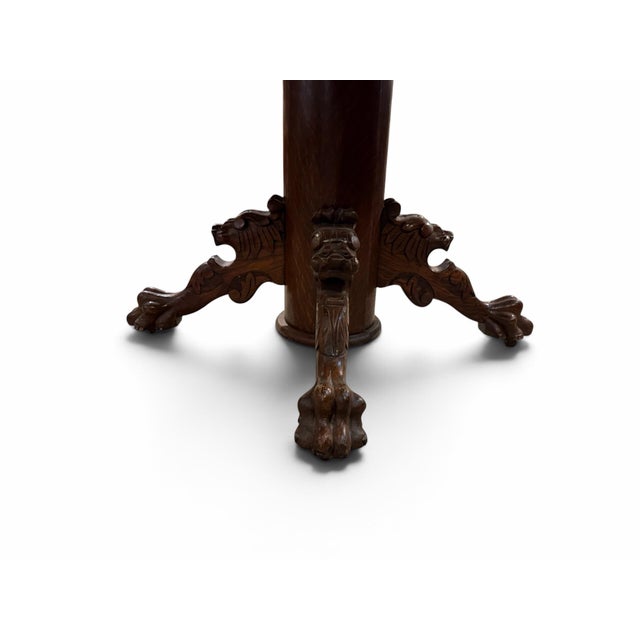 Make a grand statement in your dining room with this magnificent turn-of-the-century antique pedestal dining table....