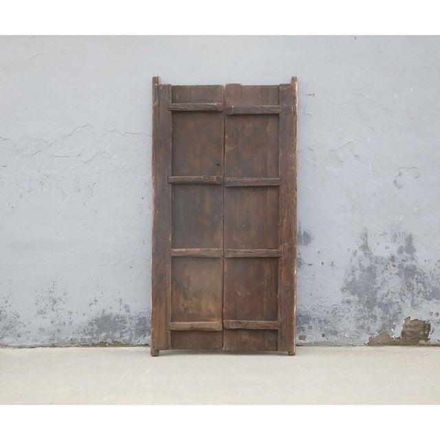 A striking antique Chinese double-panel door, hand-painted with a bold tiger motif and dating to the late Qing dynasty....