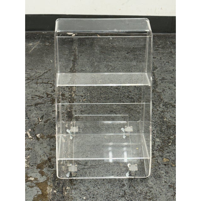 Design Plus Gallery presents the Acrylic Rolling Book Cart from Crate & Kids. This clear acrylic cart creates a floating...