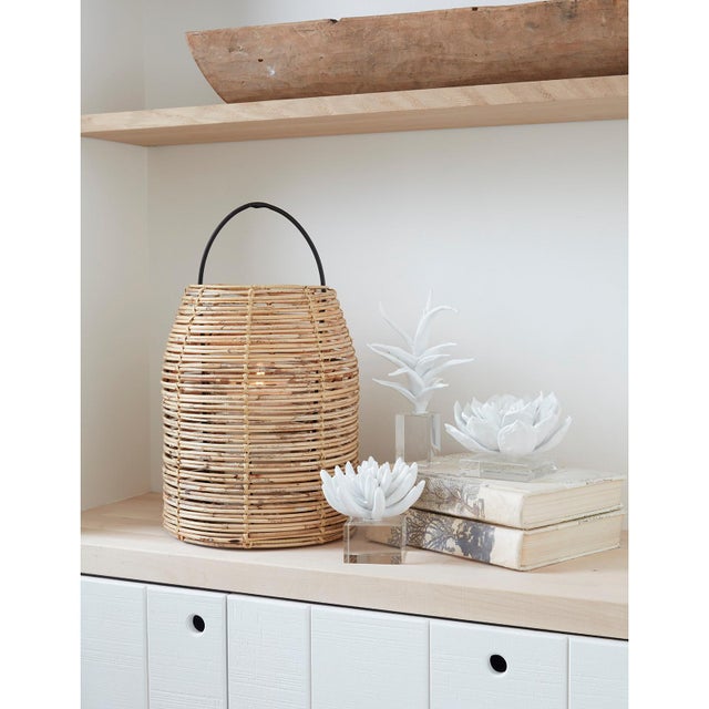 This natural bamboo hurricane sparks a desire for warmer days. Add a candle to let a soft glow peek through its woven...