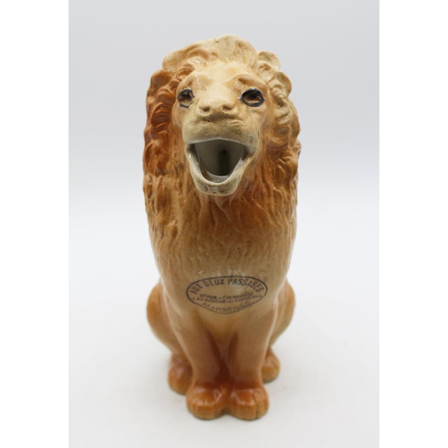 Mid-20th century stoneware French lion jug. For a bistro, clearly marked for "Aux Deux Passages 11 Rue de l'Acadamie & 24...