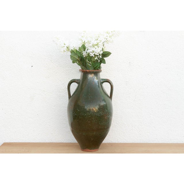 A striking piece of Provencal history, this tall earthenware jar was originally utilitarian, designed to store precious...
