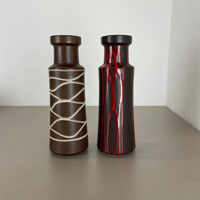 Article: Set of two fat lava art vases. Producer: Scheurich, Germany. Decade: 1970s. These original vintage vases was...