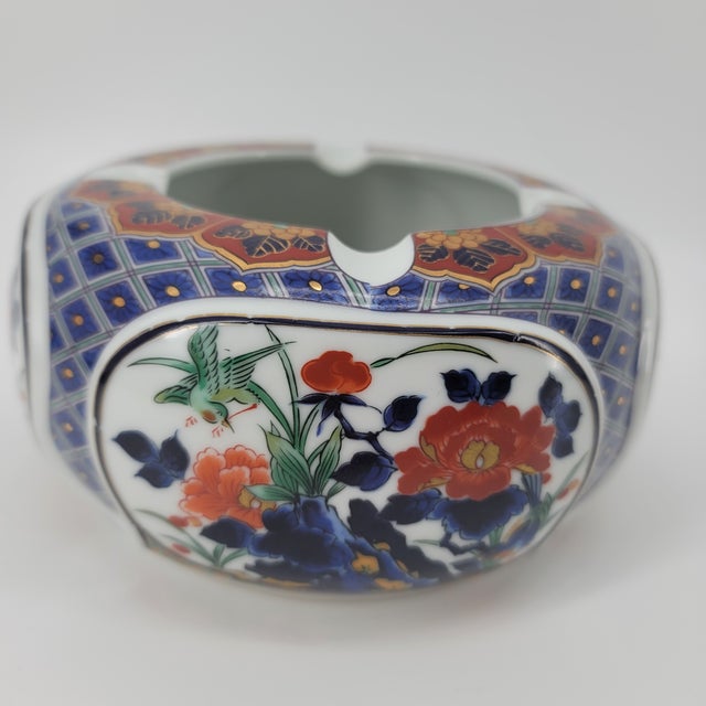 A stunning mid-century Japanese porcelain ashtray in the classic Imari (Arita-style) tradition. This piece features a...