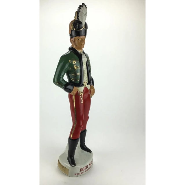 Interesting and unusual decanter which has stood up to decades of display. He is bold and beautiful. He has been repaired...