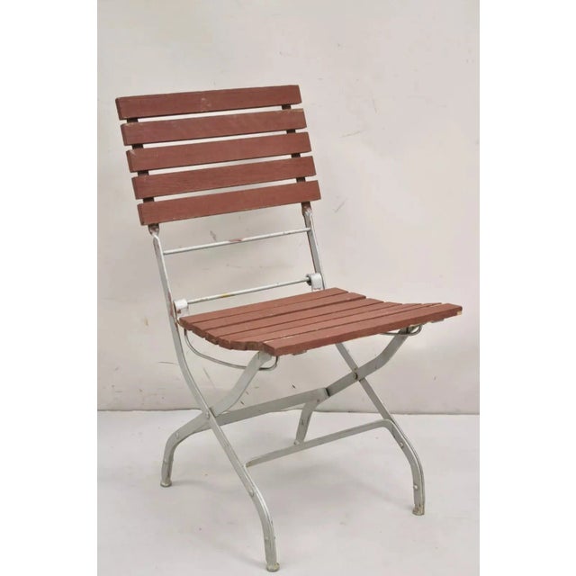 French Country Style Wood Slat Iron Frame Brown and Silver Painted Folding Garden Chairs - Set of 4. Circa Late 20th...