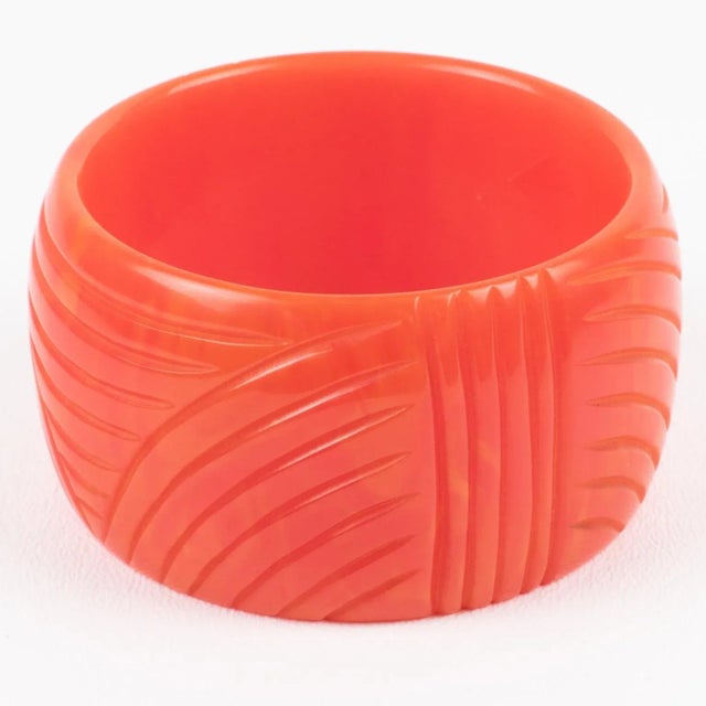 This is a lovely pink tequila sunrise marble Bakelite bracelet bangle. It features a rare chunky domed oversized shape...