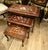 Add timeless European character to your interior with this elegant set of three French-style nesting tables. Crafted...