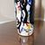 Bring an avant-garde and eclectic edge to your interior styling with this striking hand-painted decorative glass bottle....