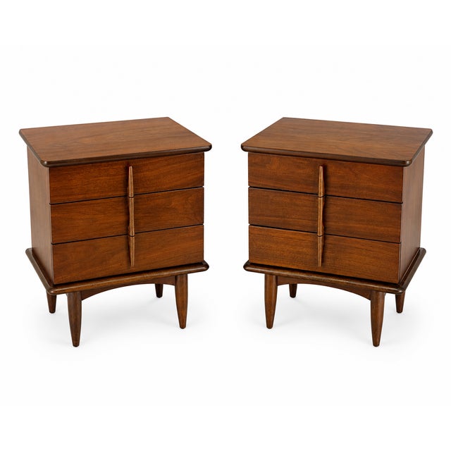Pair of walnut Mid-Century Modern three drawer nightstands or end tables. Sculptural walnut pulls. Similar to: United...