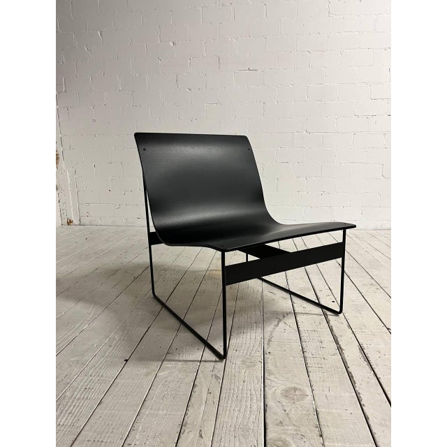 Vintage lounge chair by Günter Renkel. This modernist design from the 1950s is made from delicate metal parts and molded...