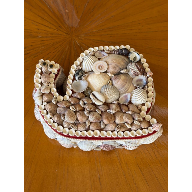 A delightful piece of vintage Florida kitsch, this handcrafted seashell trinket box is designed in the form of a whimsical...
