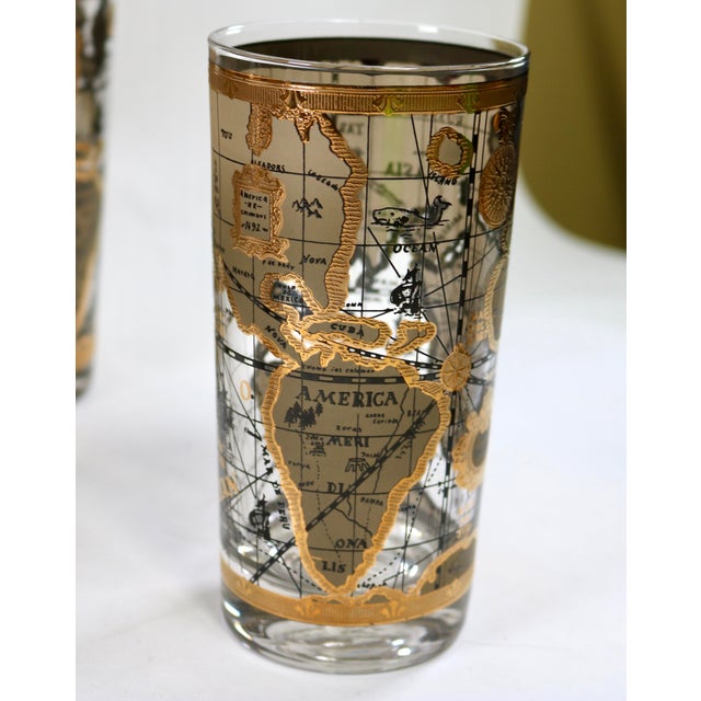Sip your cocktails in style with these gilt highball glasses featuring the Old World Map pattern by Cera Glass. The rich...