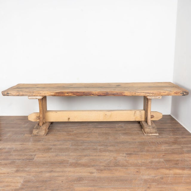 19th-century French oak dining table with substantial thick top and trestle base. Just under 10 feet long with substantial...