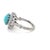This gorgeous antique ring boasts an oval cabochon turquoise measuring approximately 8.80 x 7.10 x 4.96 mm, surrounded by...