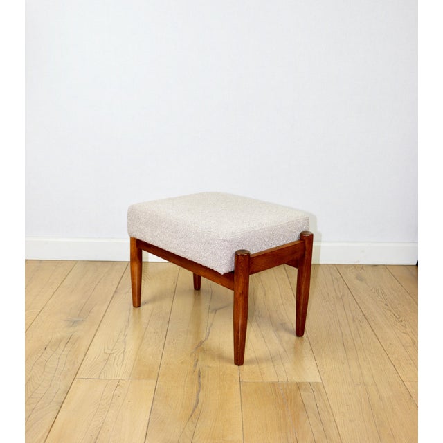 Edmund Homa stool with a beige boucle seat and dark legs. This stool, designed by Edmund Homa and manufactured in the...