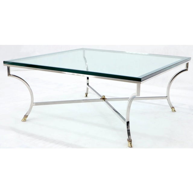 Midcentury Italian modern brass hoof feet chrome X stretcher base coffee center table of Maison Jansen style.