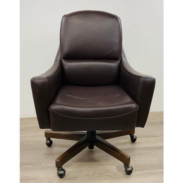 Stylish Modern Dark Brown Leather Adjustable Desk Chair, wood base with pewter metal casters, showroom floor sample