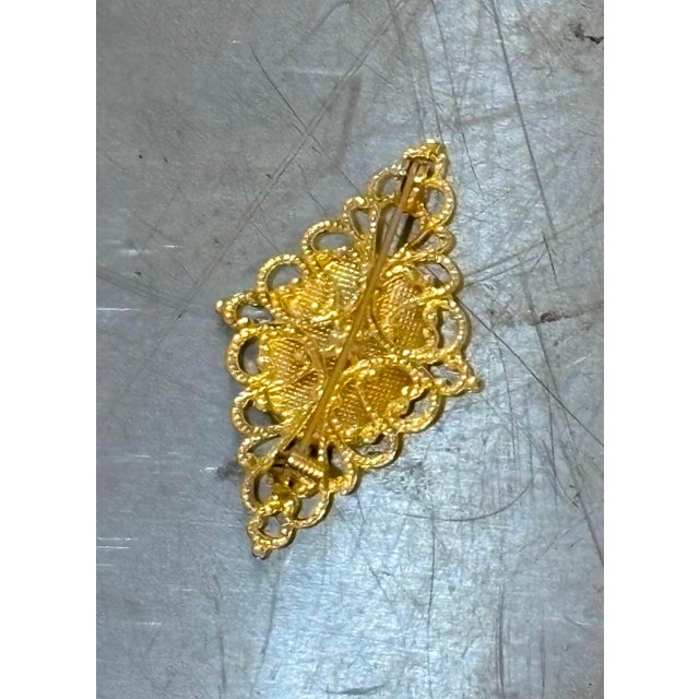 1930s-40s gold/black damascene bird brooch. Excellent condition.