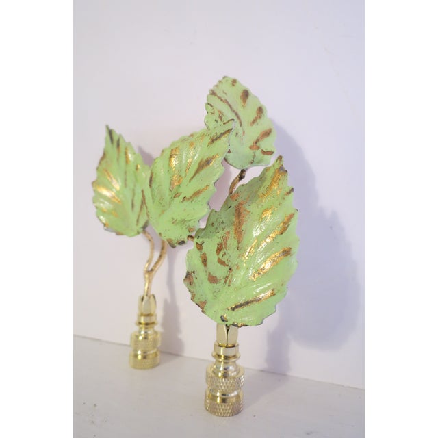 Absolutely one of a kind vintage Italian Tole Leaf lamp finials. Sold as a pair, one is a 2 leaf, one a 3 leaf, both set...