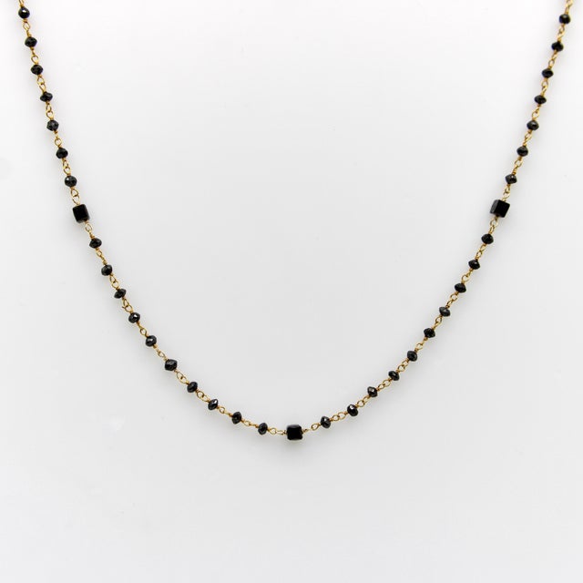 Making a hand-wired chain like this is a labor intensive process, beginning with the tiny hand-faceted black diamonds,...