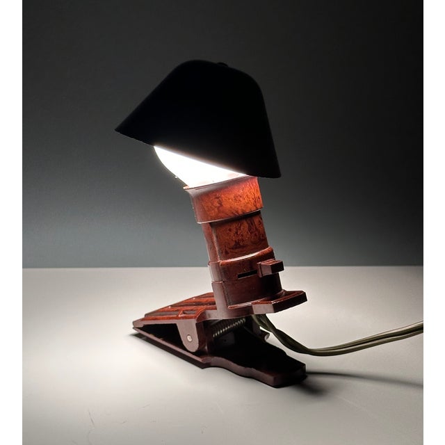 This small impressive clamp travel reading light was manufactured in Germany in the late 1940s and early 1950s. It is made...