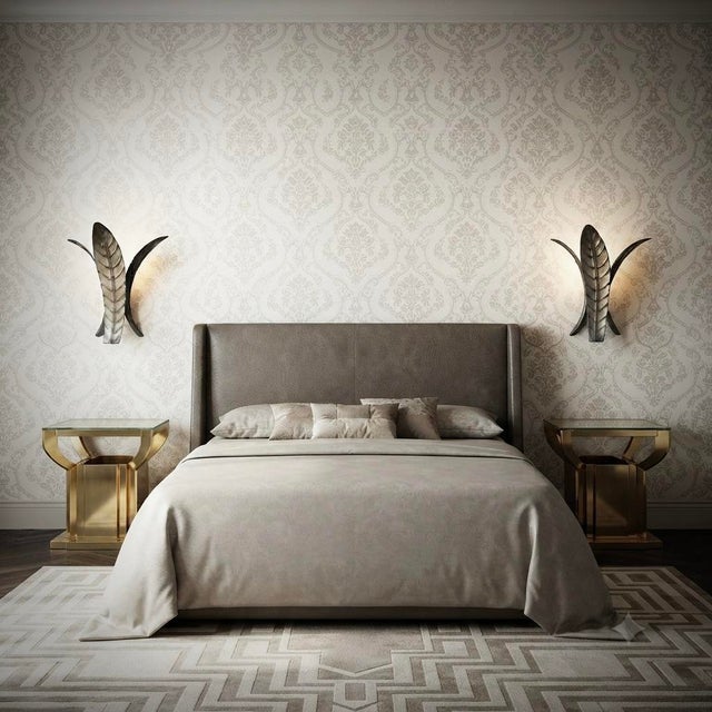 A highly original Murano glass wall sconce featuring an extremely elongated design of silver glass leaves. The Murano...