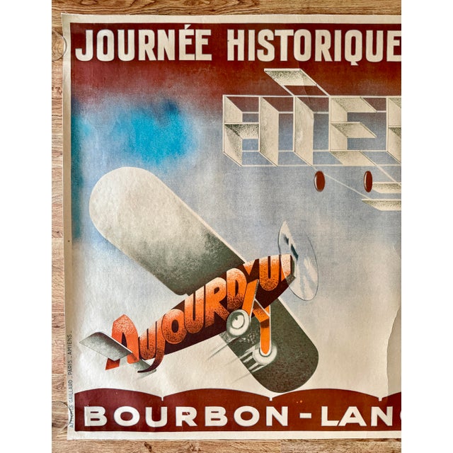 This amazing, historic poster dates to 1931 and advertises an aviation exhibition in Bourbon-Lancy. The poster lists the...