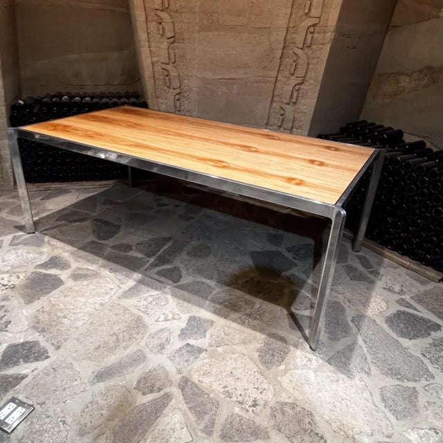 AMBIANIC presents 1970s Milo Baughman Dining Table 42 D x 80 W x 28.5 T Polished aluminum and wood Preowned vintage...