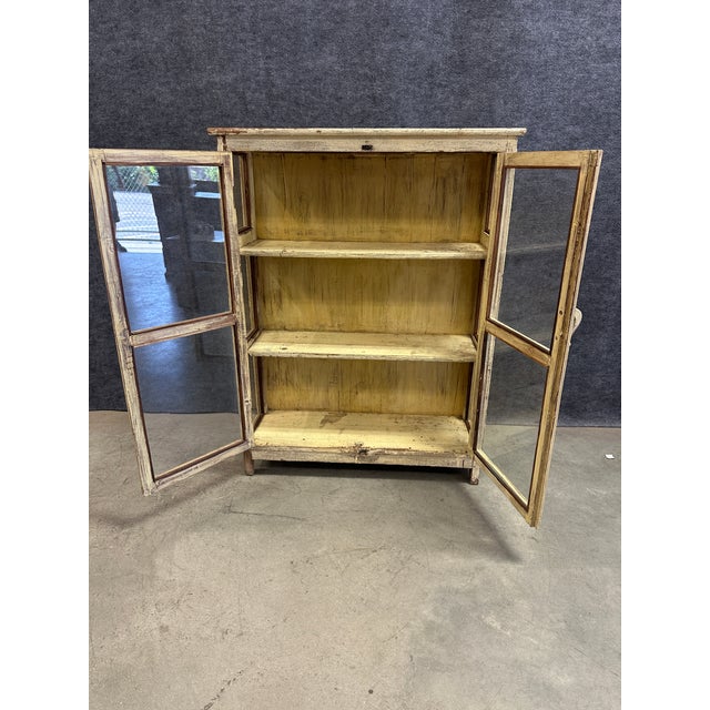 Add a touch of rustic warmth and authentic historic character to your space with this beautiful antique display cabinet....