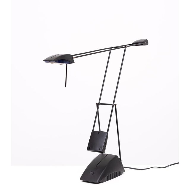 Typical 80s articulated table lamp .Halogen 2 light strengths. good condition. European Plug (up to 250V).The wiring of...