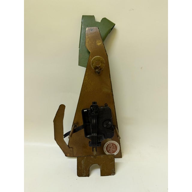Bring a playful touch of Latin American folk art into your space with this large, hand-painted metal "Green Dog" wall...