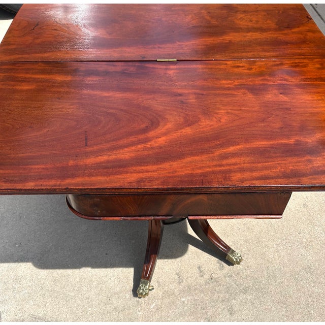 Wood Antique Flame Mahogany, Regency-Style, Flip-Top, Rotating, Game Table, W/Hidden Drawer, Carved Pedestal, Brass Claws and Casters. C1810 to 1820 For Sale - Image 7 of 12