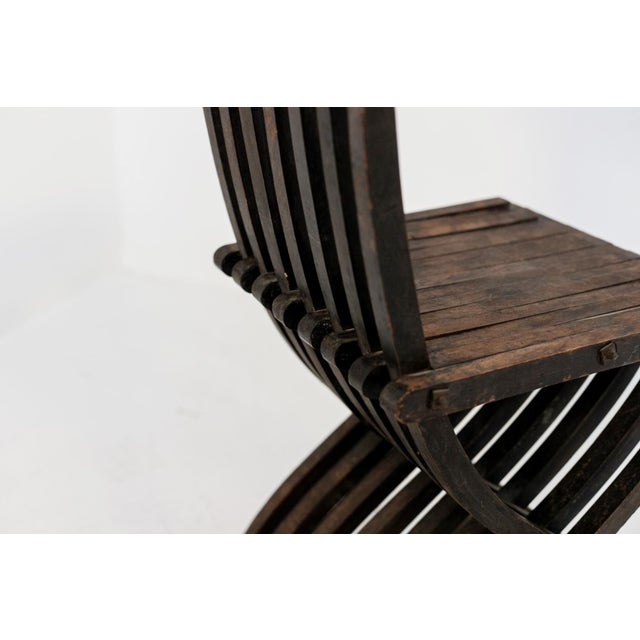 The vintage chair is from the 30s and is of fine Italian manufacture. Made in fine dark wood with inlays. The unique chair...