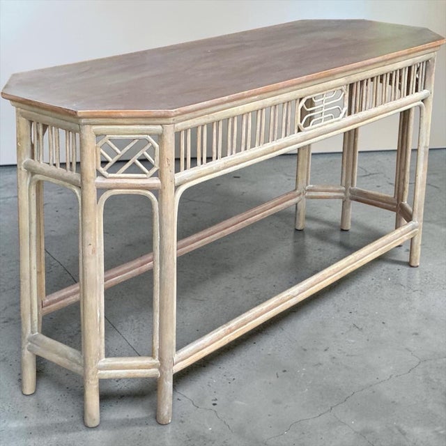 This is a 1970s Chinese Chippendale style cerused bamboo console table with wood top. It is in very good condition and is...