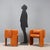 A pair of armchairs with cognac-colored leather upholstery. They show some signs of wear, as shown in the photographs....