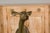 A Continental life size bronze sculpture depicting a deer, circa 1930. Elevate your outdoor space with the captivating...