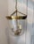 The Merchant Fixture by Visual Comfort is a classic lantern-style fixture in antique brass. This simple pendant is...