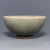 Fine antique Chinese celadon bowl featuring subtle floral‑relief ornament at interior base. Finely crackled muted green...