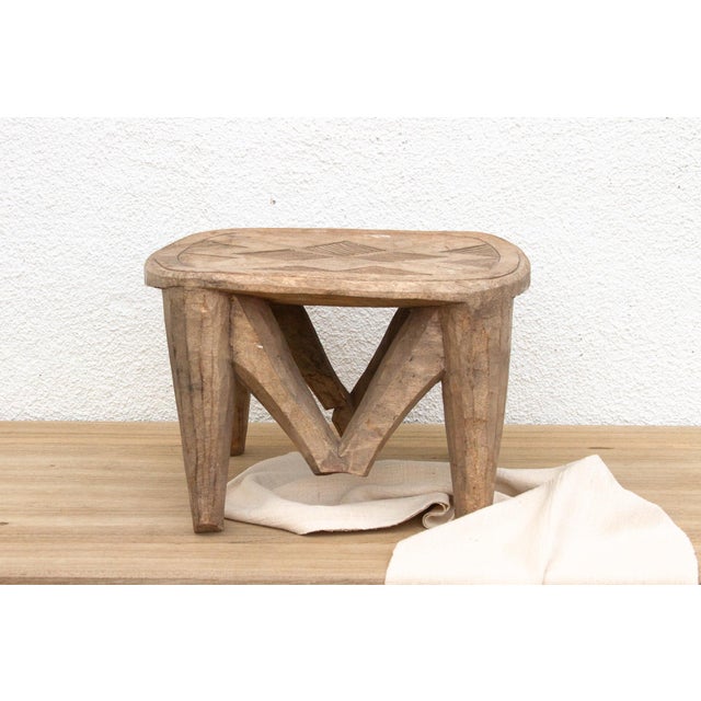 A unique piece of African art, this vintage Nupe table from Nigeria is a must-have for collectors and enthusiasts of Nupe...