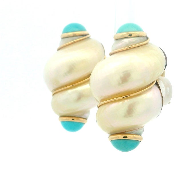 A bold, oversized pair by MAZ, designed with volume and ease in mind. The domed shell centers are wrapped in smooth 14K...