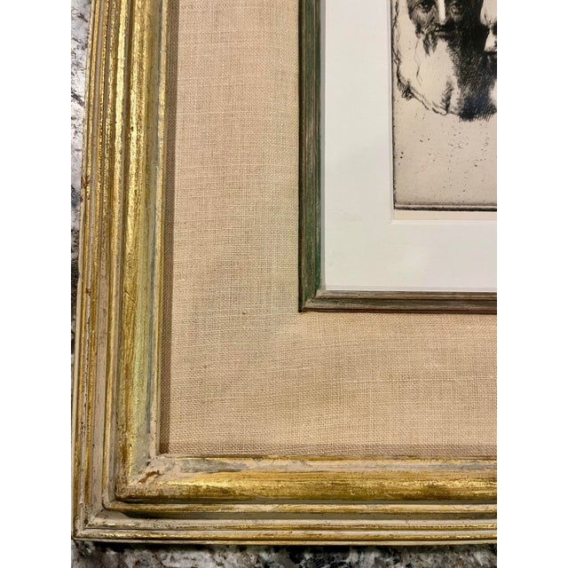An original Artist’s Proof (A.P.) etching by Kansas printmaker Harold W. Hogan (1950–2002), depicting two expressive male...