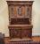 19th C Belgian hand carved walnut cupboard. Locks and comes with original key. Glass in doors are original and beveled....