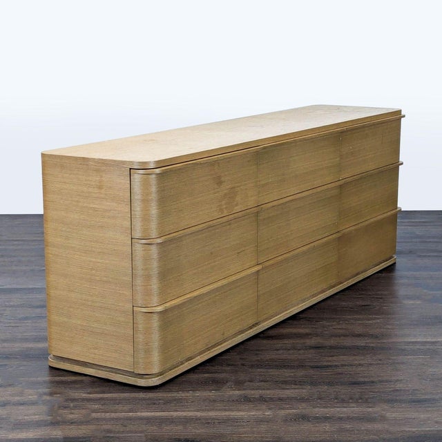 This Restoration Hardware dresser features a sleek modern design with a light wood finish. It offers plenty of storage...