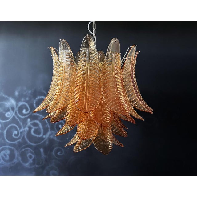 Beautiful Italian Murano Chandelier composed of 36 splendid amber glasses that give a very elegant look. The glasses of...