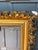 An extraordinary oversized antique Rococo Revival giltwood frame featuring lavish openwork foliate carving, scrolling...
