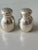 A pair of mini sterling silver John Hasselbring salt & pepper shakers engraved with a "C" for charming ~ if "C" is not...
