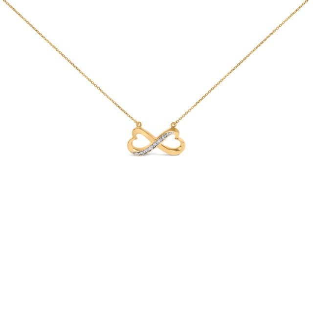 Designed as an eternal whisper of devotion, this pendant traces the infinity sign through two open hearts, their polished...